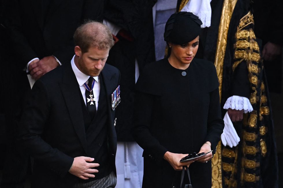 duke and duchess of sussex leave after a service for the reception of queen elizabeth ii's coffin at westminster hall, in the palace of westminster