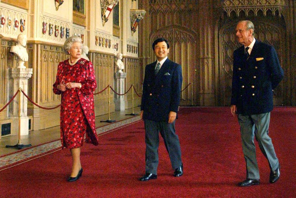 Britain's Queen Elizabeth II (L) escorts Crown Pri