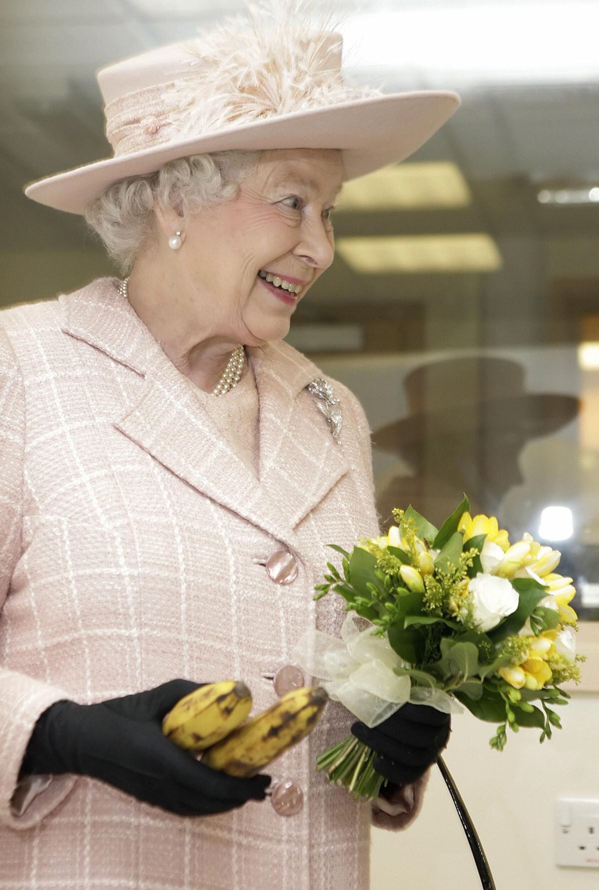 Britain's Queen Elizabeth II holds a bun