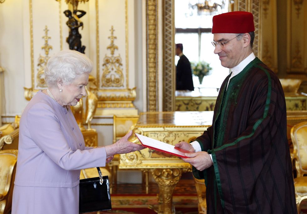 The Queen receives credentials from Nabil Ammar, the Tunisian ambassador in the White Drawing Room at Buckingham Palace, May 2013