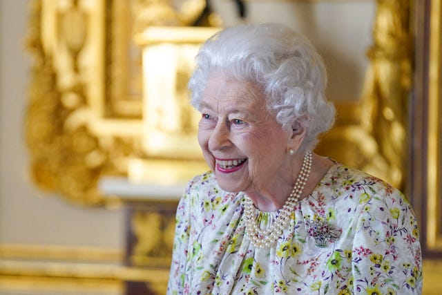 Queen Elizabeth Beams As She Attends Windsor Castle Engagement