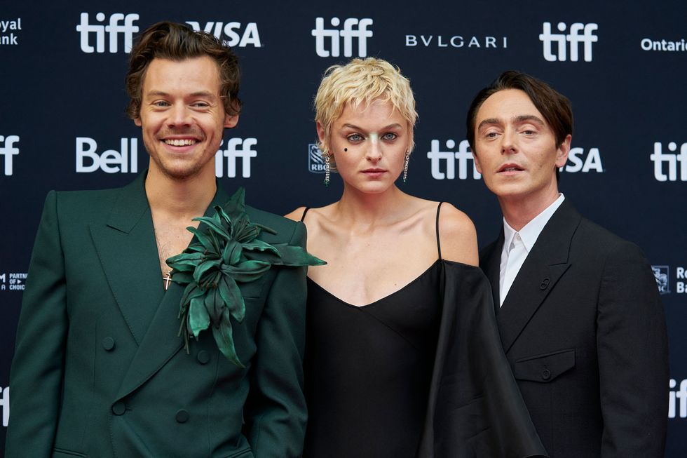 harry styles, emma corrin and david dawson pose at the toronton international film festival before the premiere of their film 'my policeman'