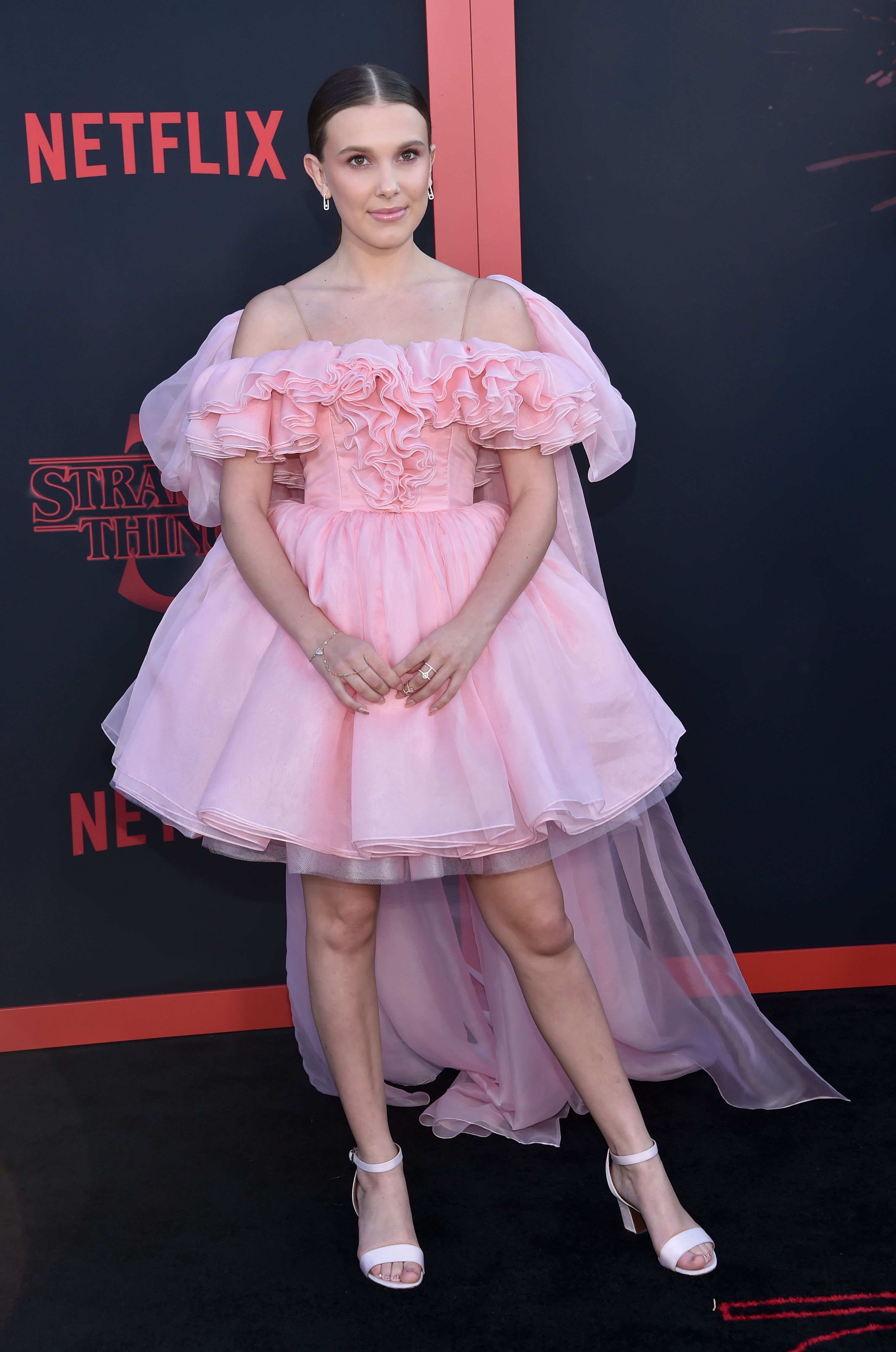 Millie Bobby Brown: Pink Mini Dress, Black Boots