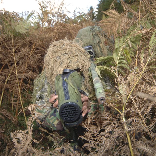 a british army sniper team dressed in ghillie suits
