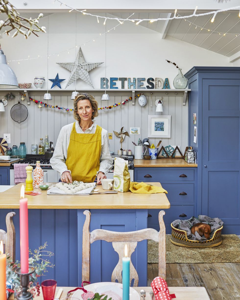 jules covey in blue kitchen