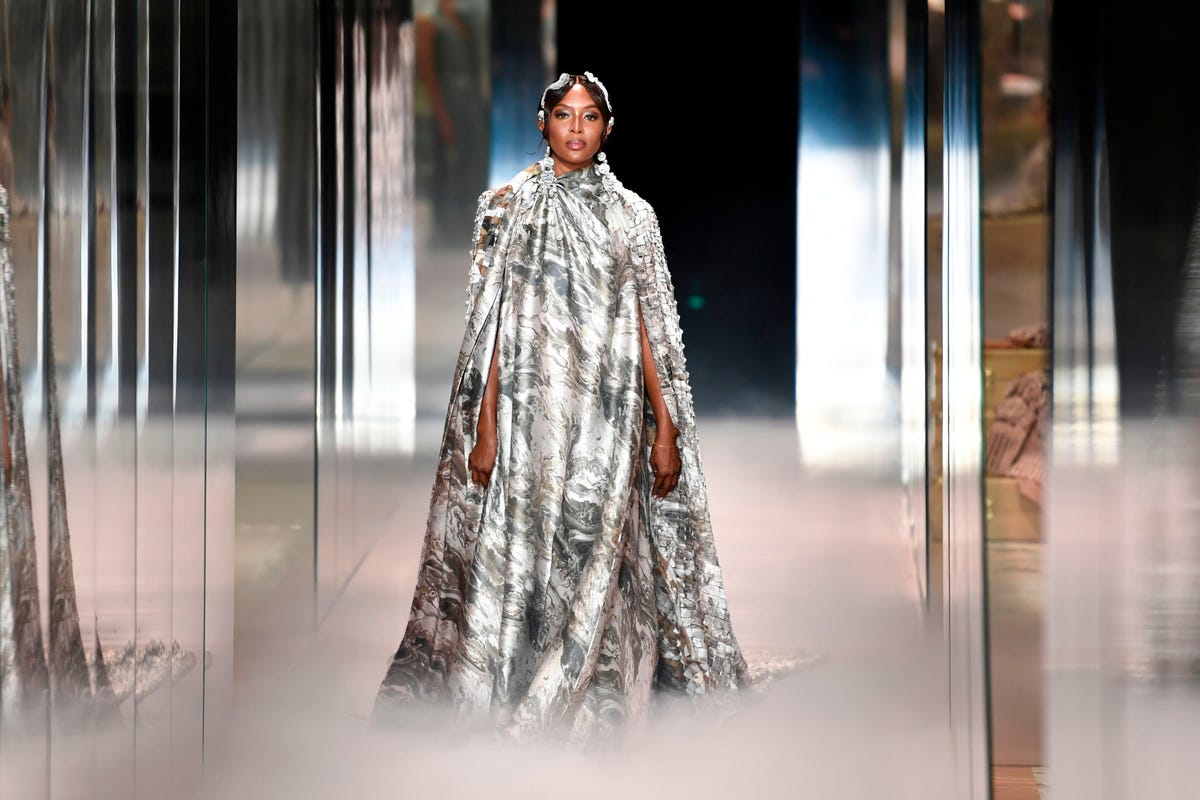 Model Naomi Campbell presents a creation from the Louis Vuitton