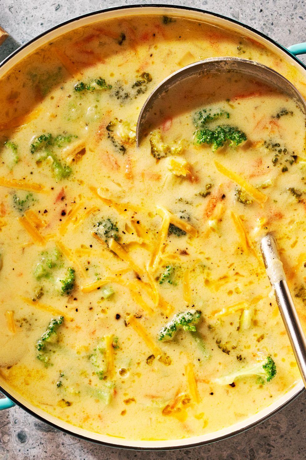 broccoli cheddar soup sprinkled with cheddar cheese