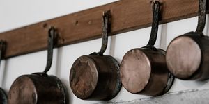 Pot rack, Shelf, Iron, Furniture, Folk instrument, Wood, Metal, Home accessories, Bell, Spoon, 