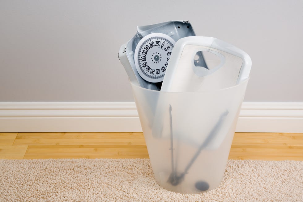 Broken bathroom scales in bin