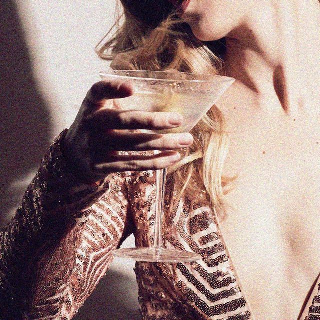 a woman holding a glass