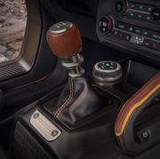 customization details include an available leather wrapped shift lever for the class exclusive 7 speed manual transmission, as well as grab handles in this prototype version of the 2021 bronco not representative of production model static display on private property with aftermarket accessories not available for sale