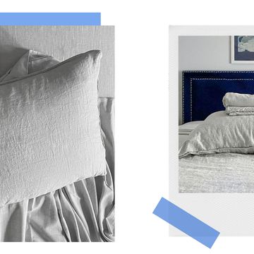 grey heathered cashmere sheets on bed with blue velvet headboard
