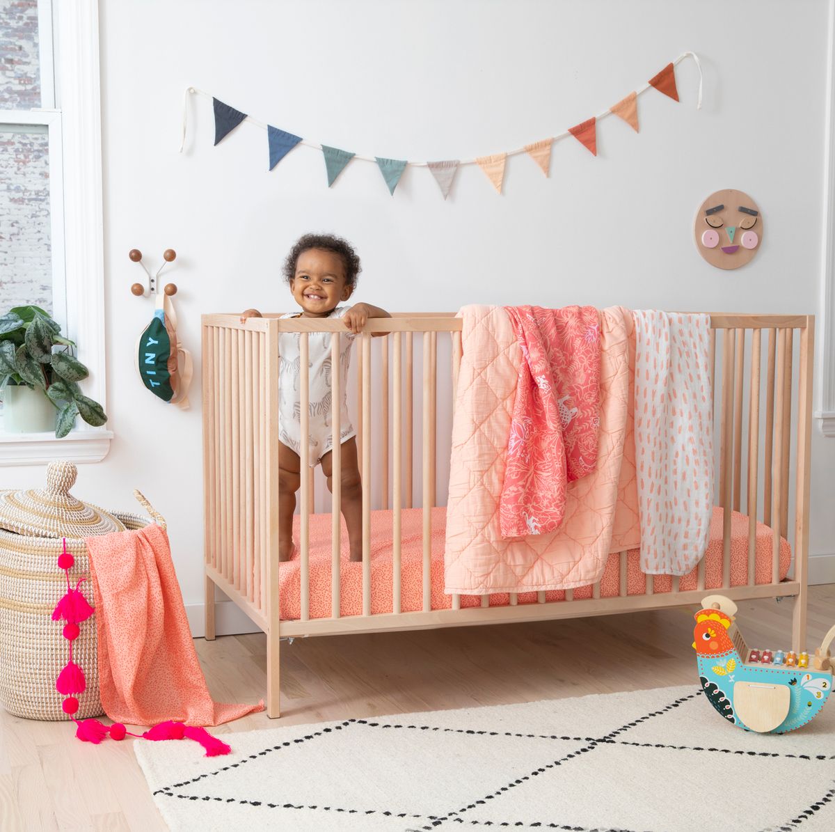 baby in crib with brooklittles bedding