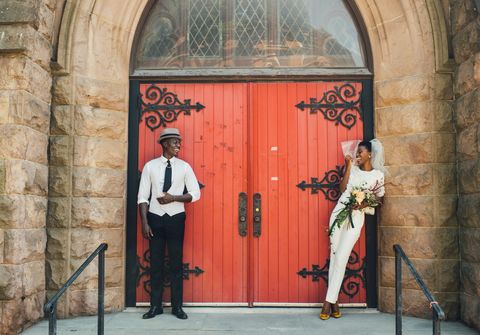 couple in front of church doors