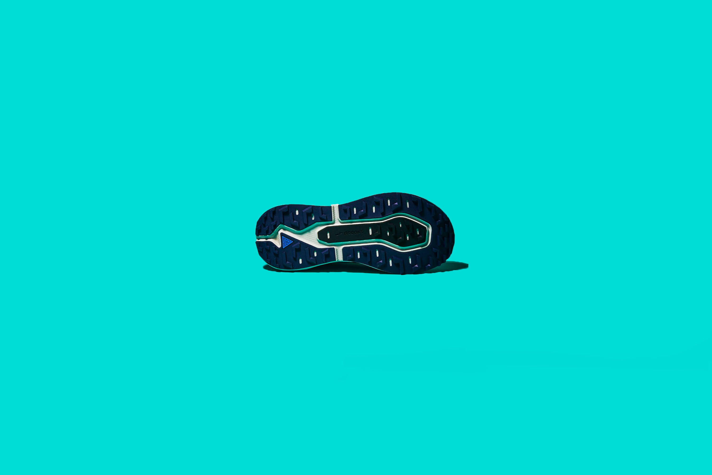 Turquoise, Teal, Aqua, Font, Logo, Footwear, Electric blue, Turquoise, Personal protective equipment, Fashion accessory, 