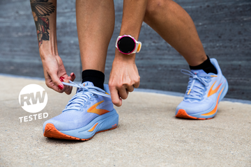 a person lacing up a pair of brooks ghost 17