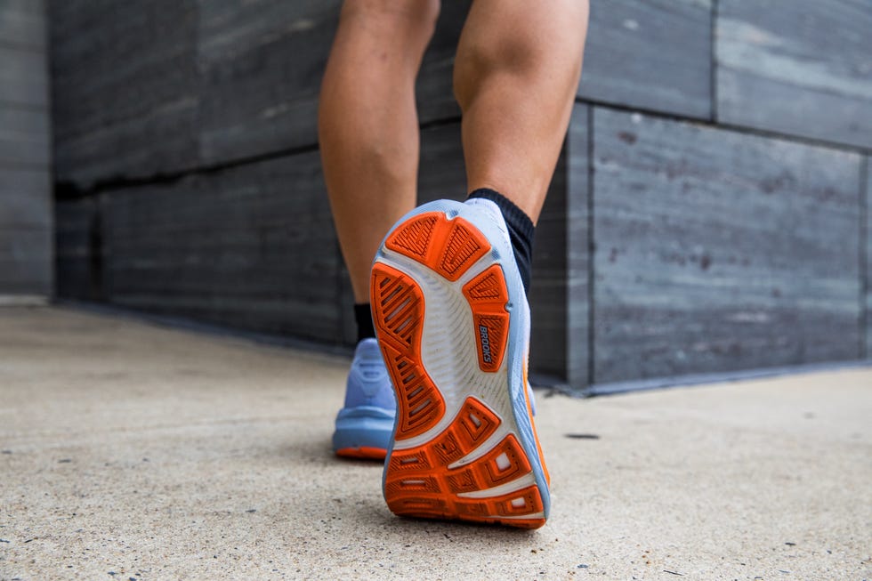 runner stretching and wearing the brooks ghost 17