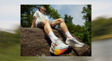 a man sitting on a rock