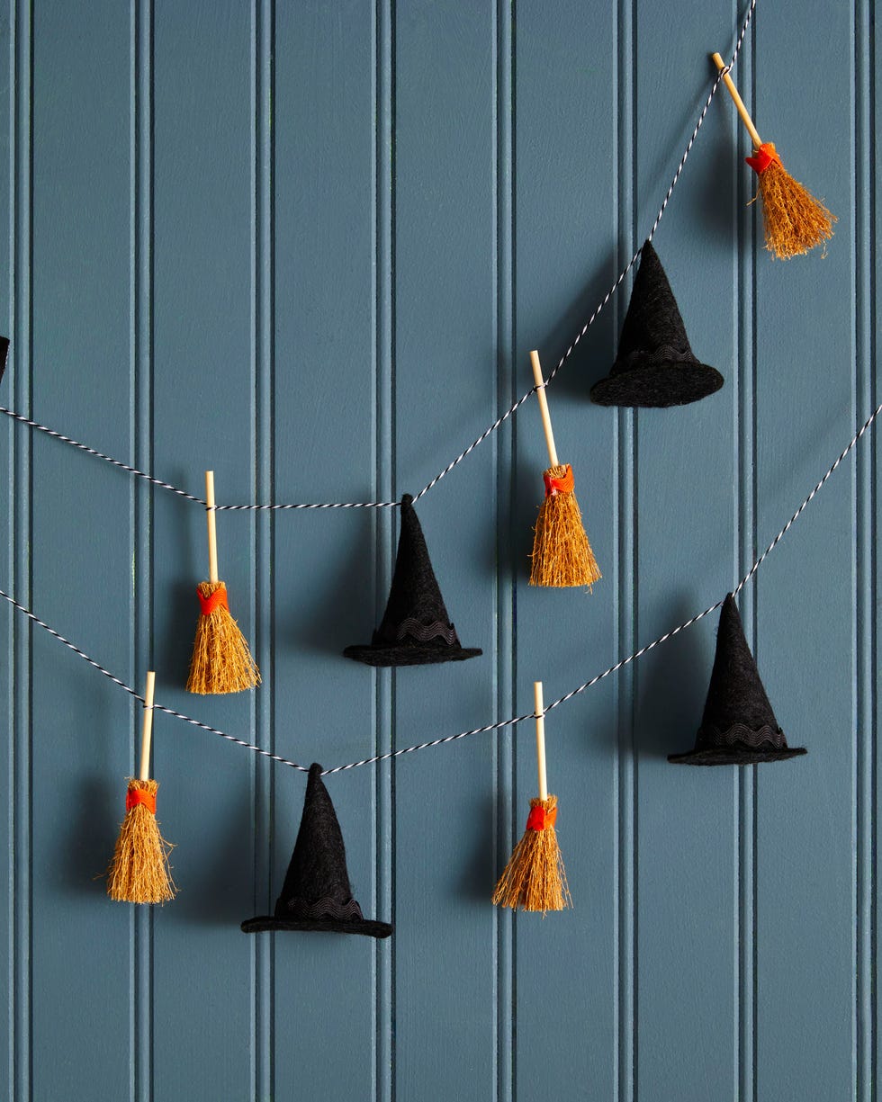 mini witch hats and brooms strung on bakers twine to form a garland mini witch hats and brooms strung on bakers twine to form a garland