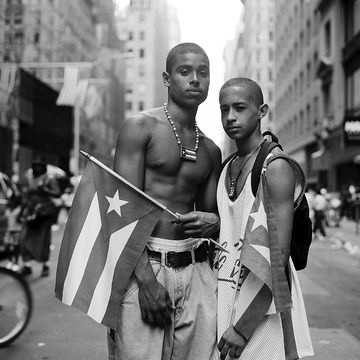 a person holding a flag next to a person holding a flag