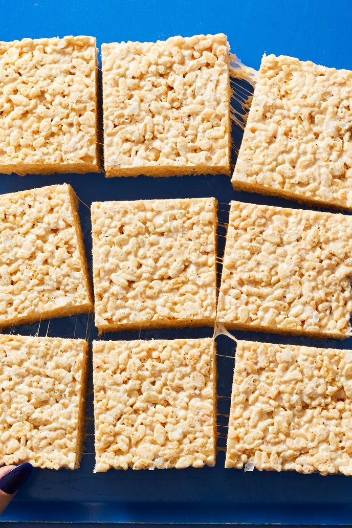 brown butter crispy rice treats against a blue background