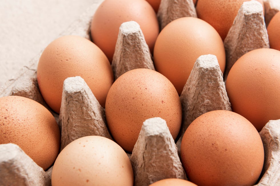 brown eggs in an egg box, close up