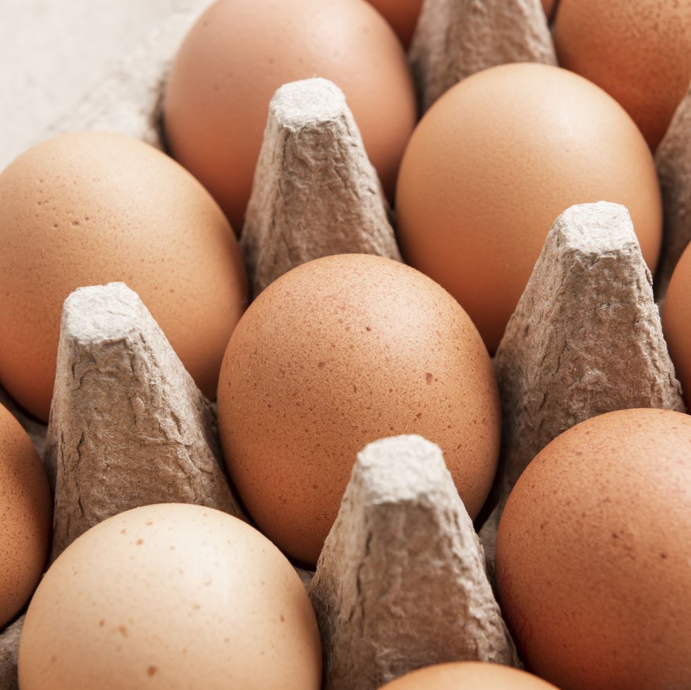 brown eggs in an egg box, close up