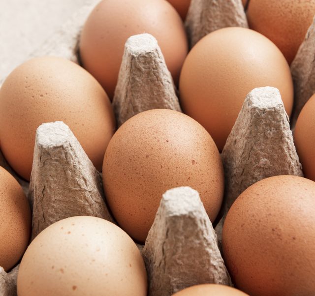 brown eggs in an egg box, close up