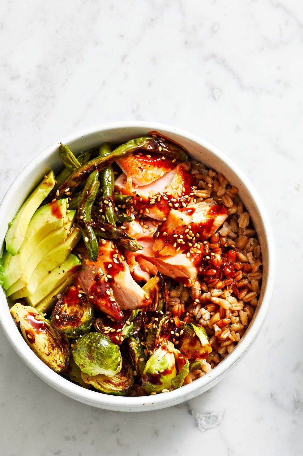 brown rice bowl with jammy eggs and olive vinaigrette
