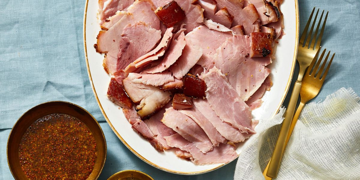 brown sugar glazed sliced ham on a white plate