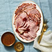 brown sugar glazed sliced ham on a white plate
