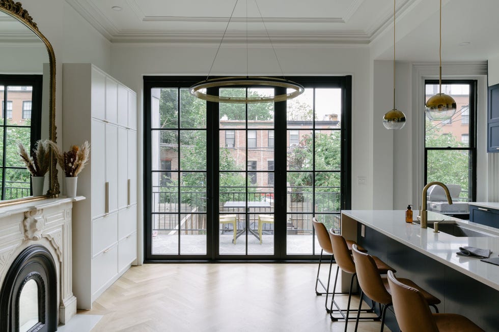 a kitchen with a fireplace and a table