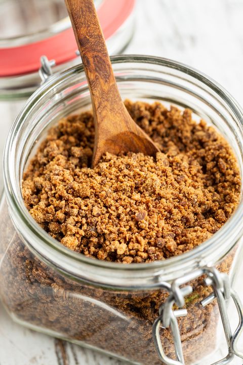 brown sugar in a glass mason jar with wooden spoon