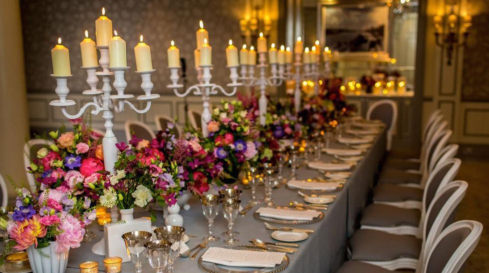 Candle, Decoration, Lighting, Floral design, Rehearsal dinner, Yellow, Flower Arranging, Wedding banquet, Function hall, Floristry, 