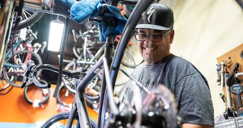 bruce mccarthy works on a bike in the mechanic’s bay sunday may 23rd, 2021