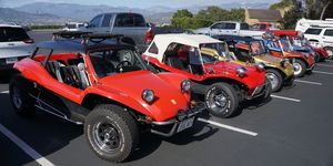 see two generations of meyers manx parked side by side
