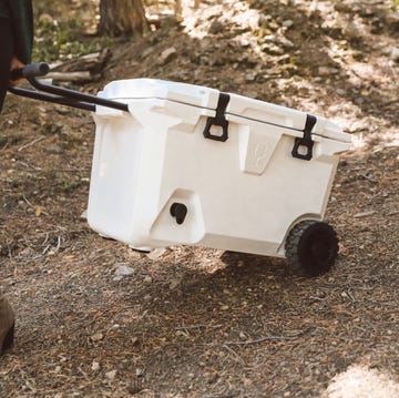 a person pulling a brutank cooler