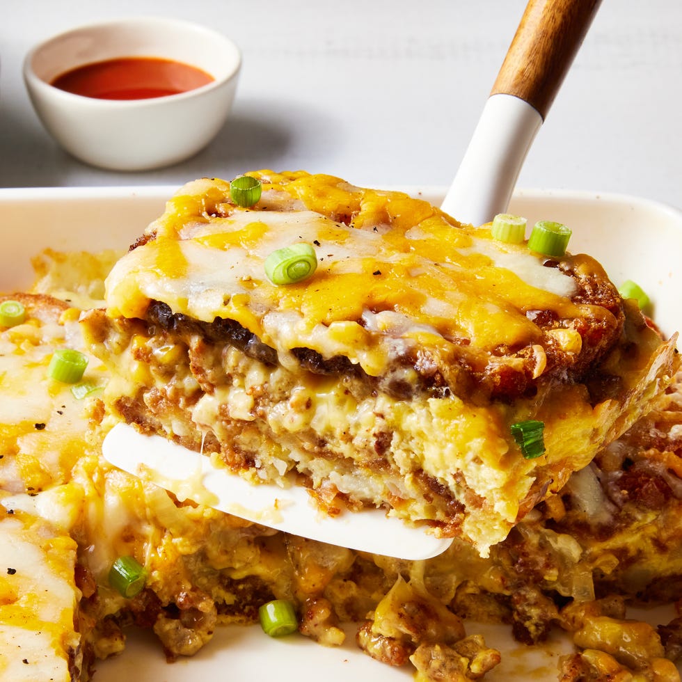 layered hashbrowns, eggs, and sausage topped with cheese and baked in a casserole dish