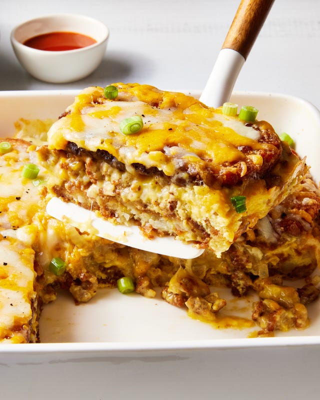 layered hashbrowns, eggs, and sausage topped with cheese and baked in a casserole dish