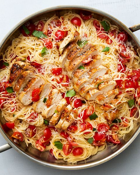 bruschetta chicken pasta topped with fresh herbs and parmesan