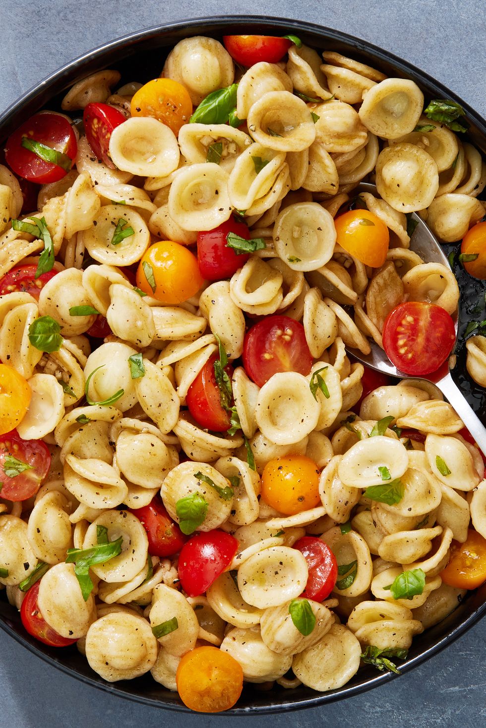 bruschetta pasta salad with fresh cherry tomatoes and basil