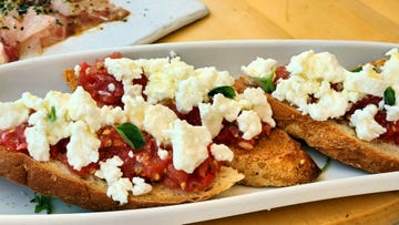 bruschetta with feta cheese and tomatoes on mykonos, greece