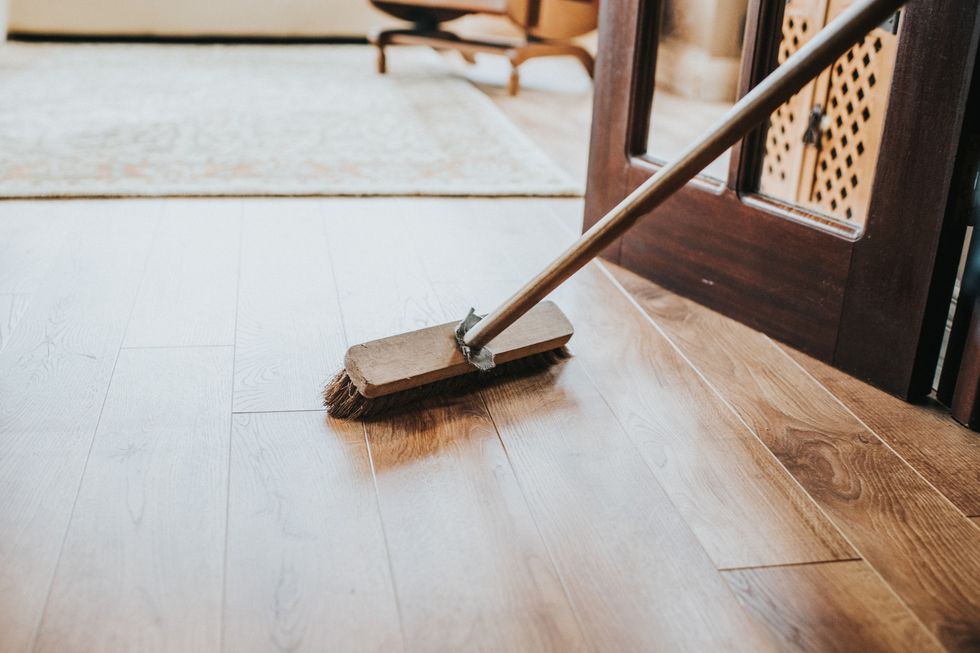brushing the floor