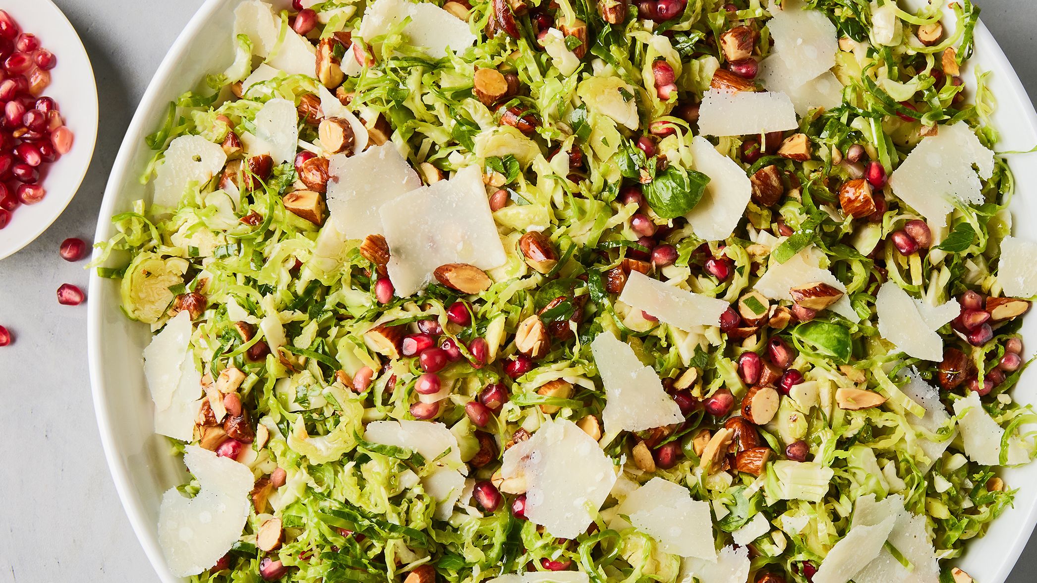 Brussels Sprouts Arugula Salad with Pomegranate and Parmesan