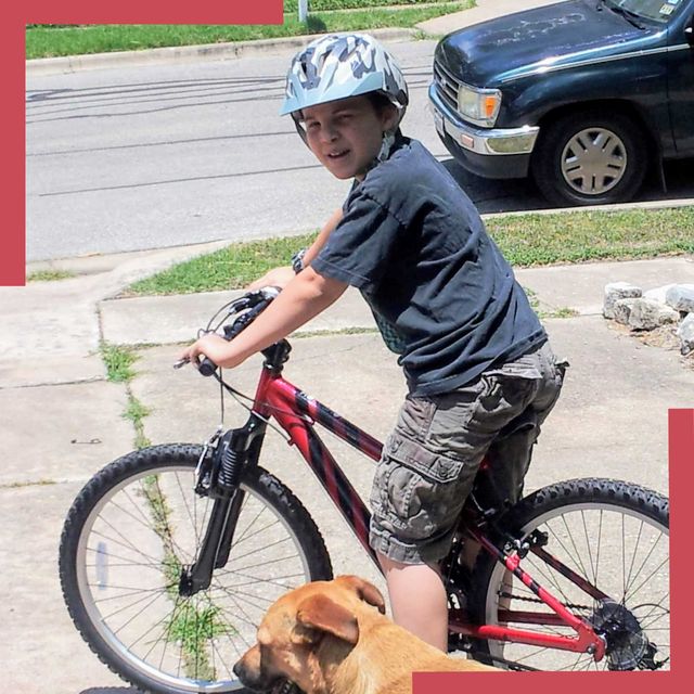 bryan albright and his red bike and dog