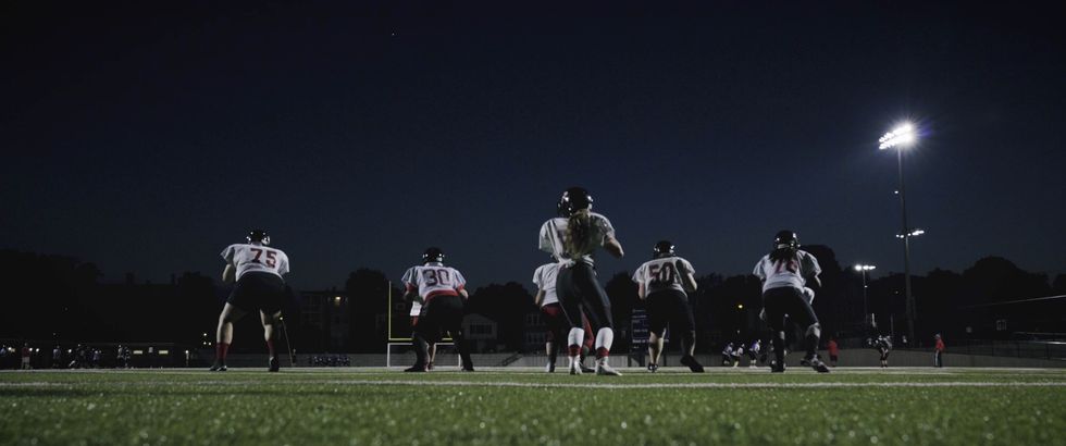 the boston renegades playing football in a night game