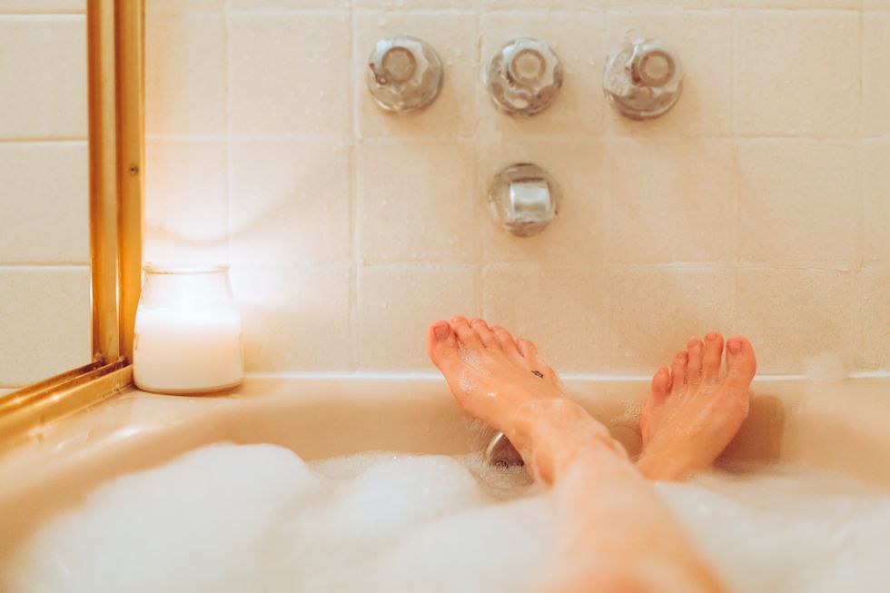 bubble bath personal perspective bath tub, woman in tub with feet up