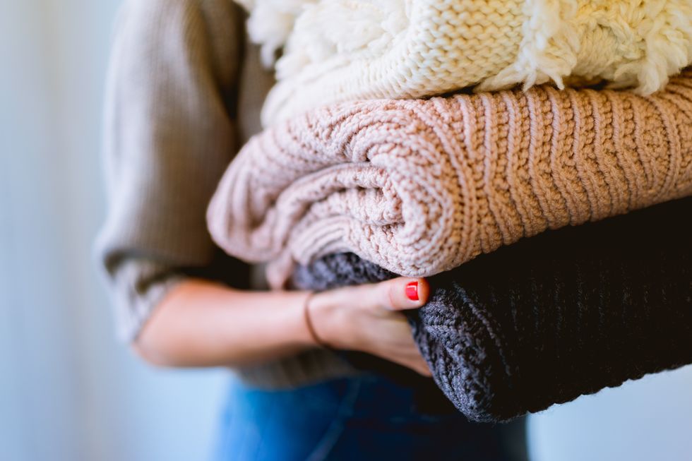 Wool, Red, Skin, Hand, Arm, Nail, Finger, Outerwear, Wrist, Sweater, 
