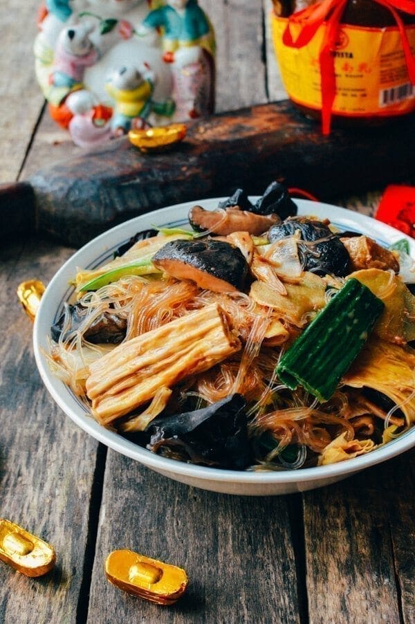 a bowl of stirfried noodles with vegetables and ingredients
