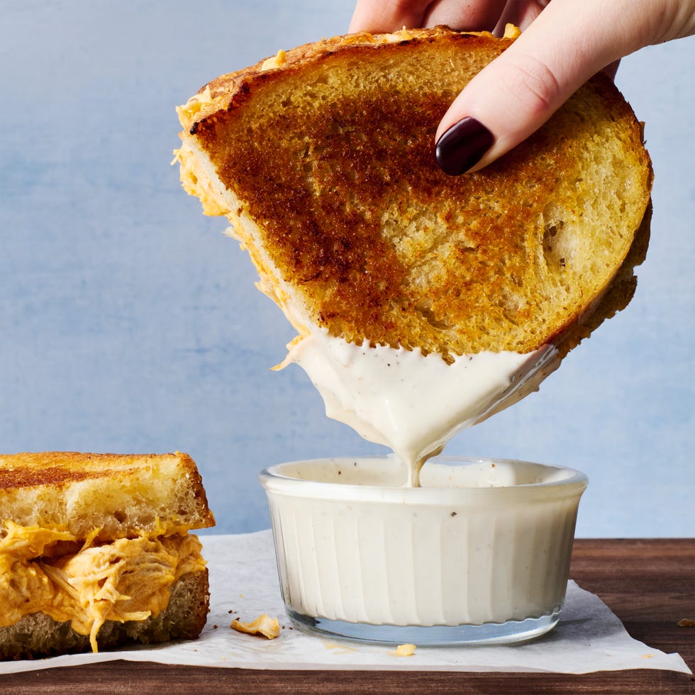 buffalo chicken mixture in a grilled cheese